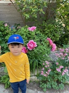 Benji posing with the flowers