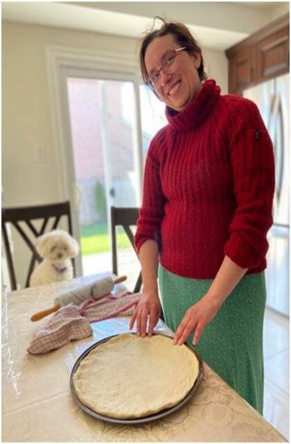 Stretching the dough into the pan