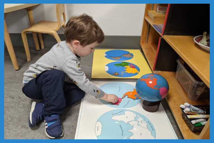 Child working with Continents of the World