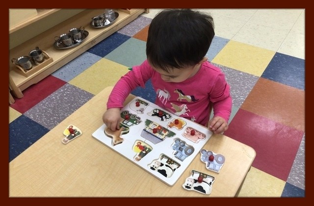 Child under 3 working on a puzzle