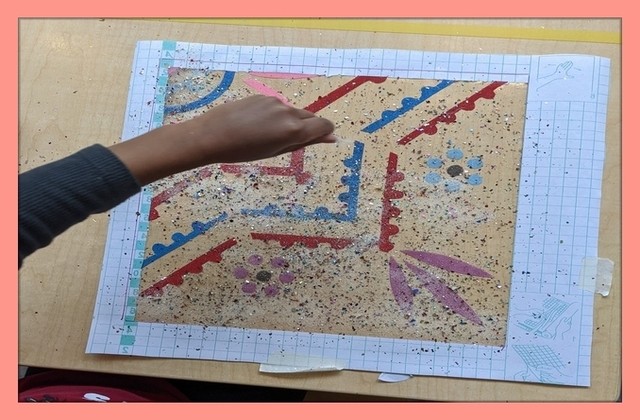 Casa child working on a rangoli art