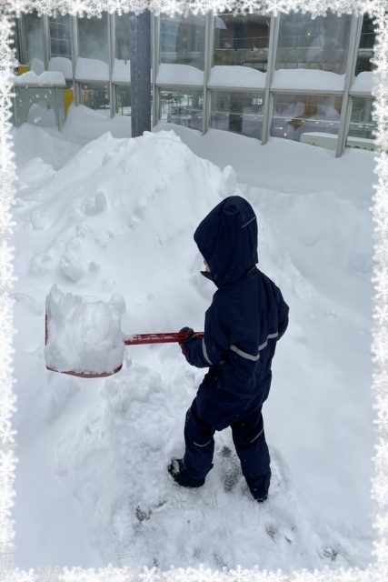 Child under 3 shovelling snow