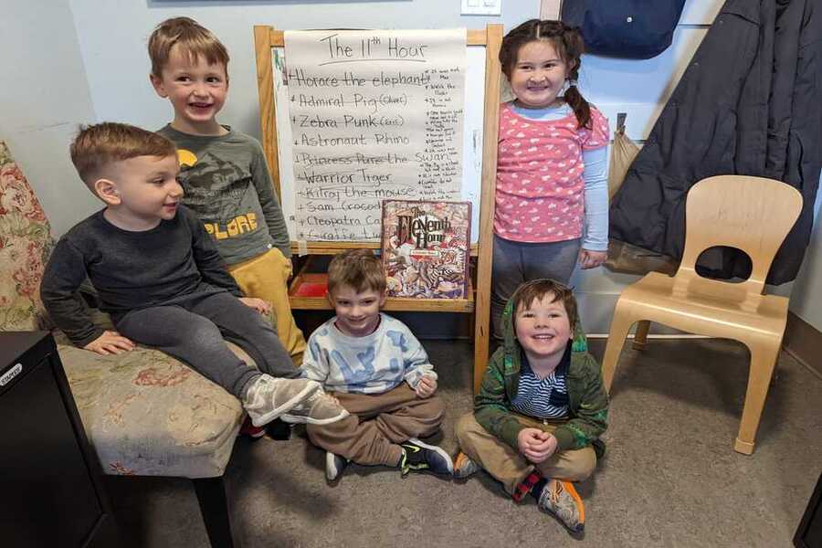 Children with the Eleventh Hour story and a board with their deductions.