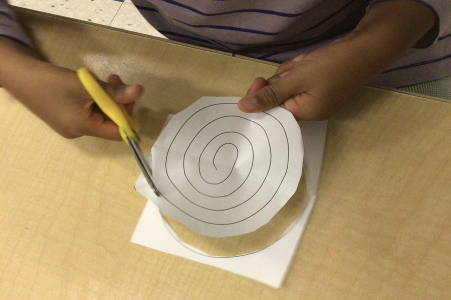 A child cutting on a circular line