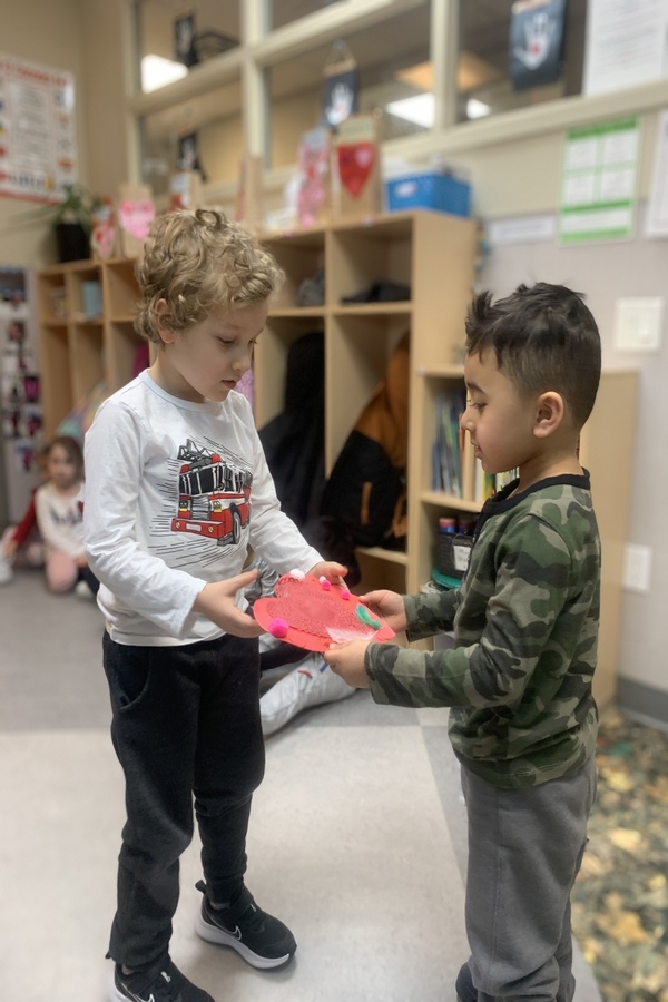 Children giving and receiving a valentine