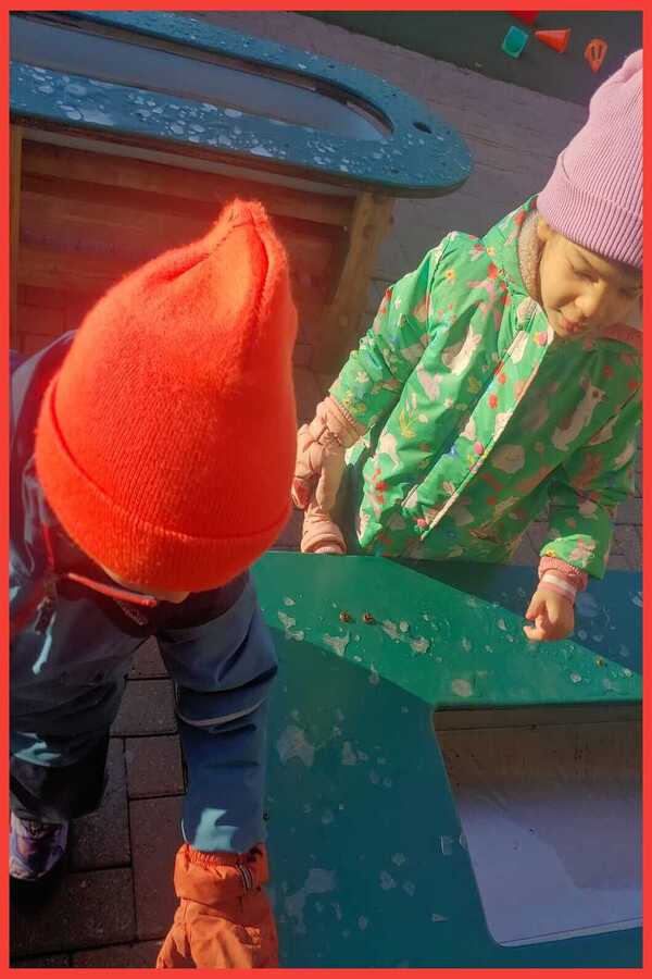 Children examining melting ice