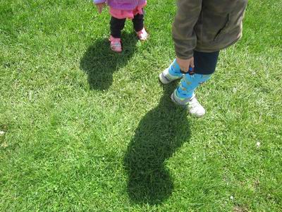 A child running after another child's shadow