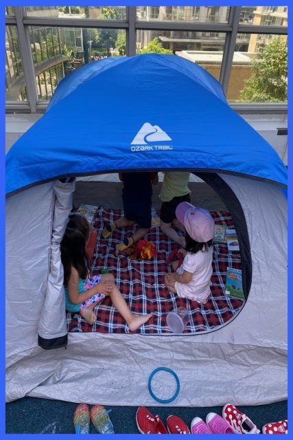 Children in a tent in the playground