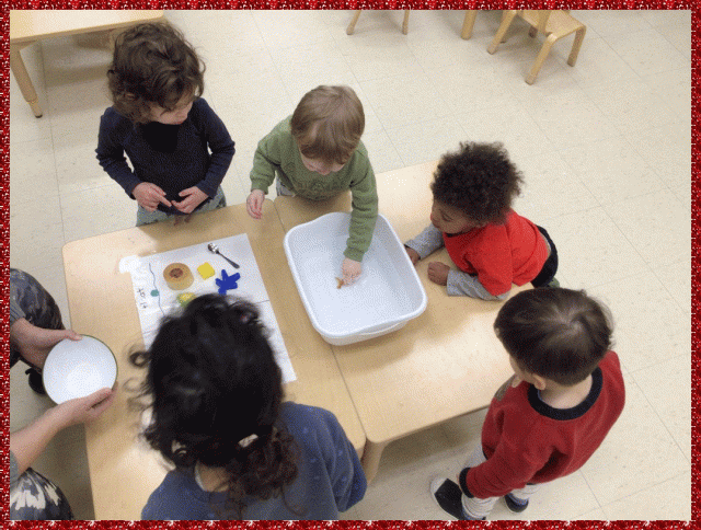 Children exploring objects in water