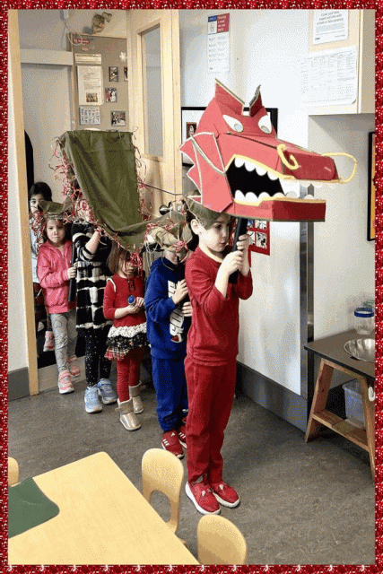 Children parading in a dragon costume
