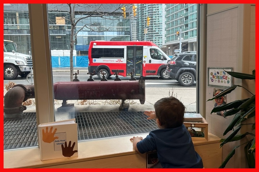 A child observing a wheel trans outside