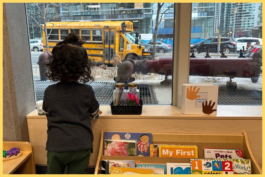A child observing a school bus outside