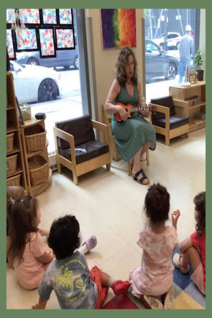 Adriana playing the banjo during music class