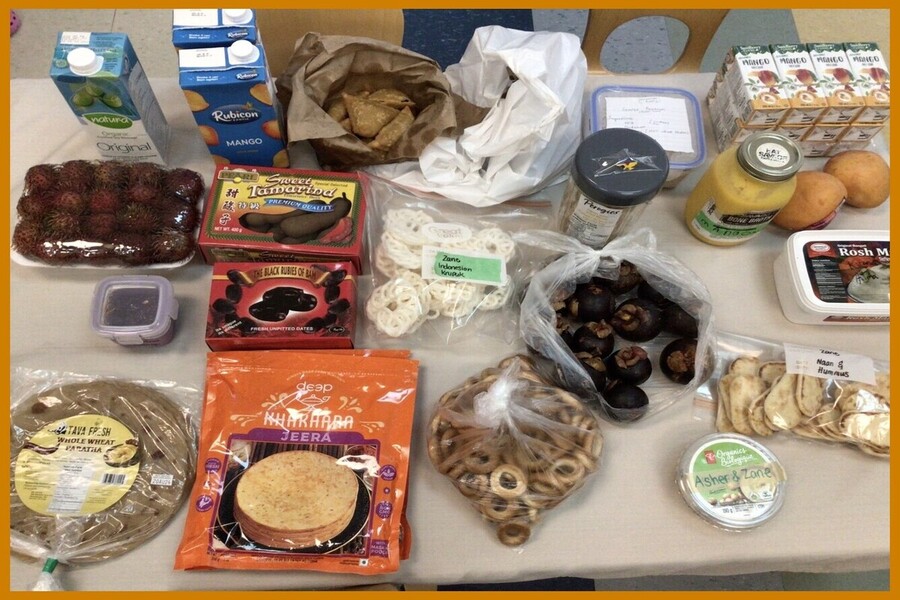 A display of international foods that our families brought in to share