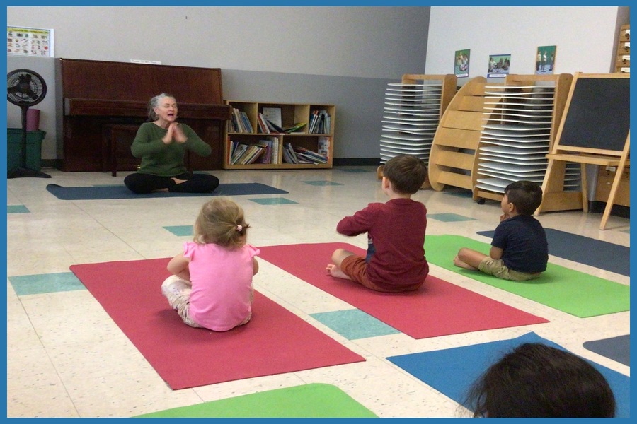 The children are imitating Cheeba doing a seated prayer pose