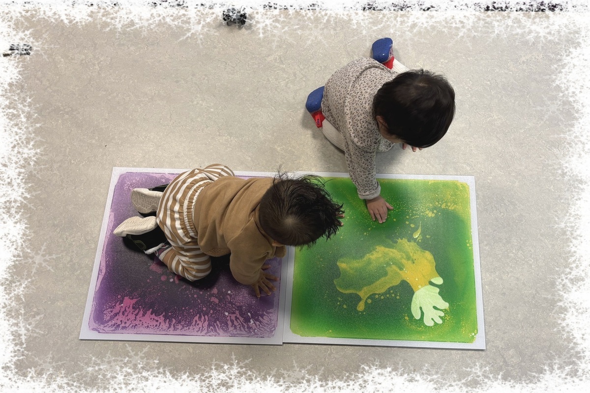 Infants crawling on and exploring lava tiles