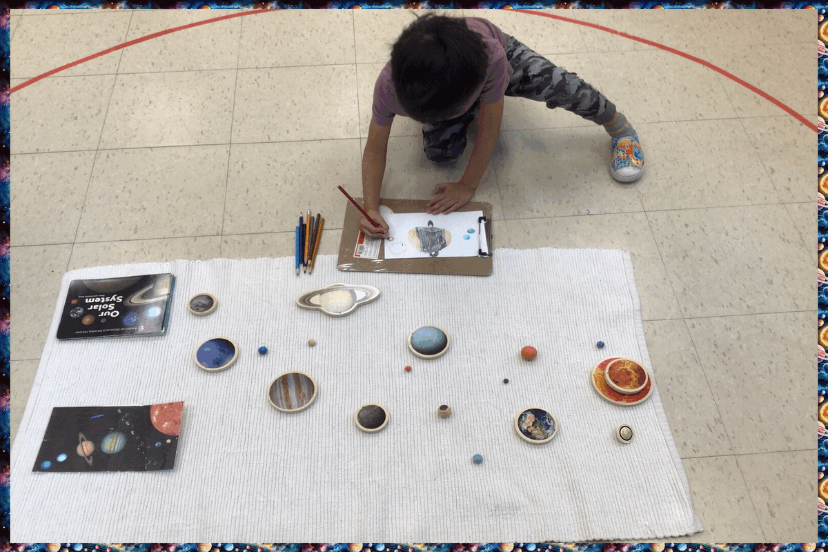 A child drawing the solar system